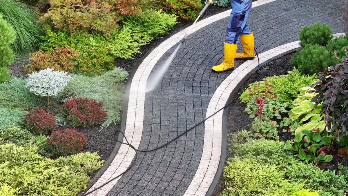 Power washing a paver walkway